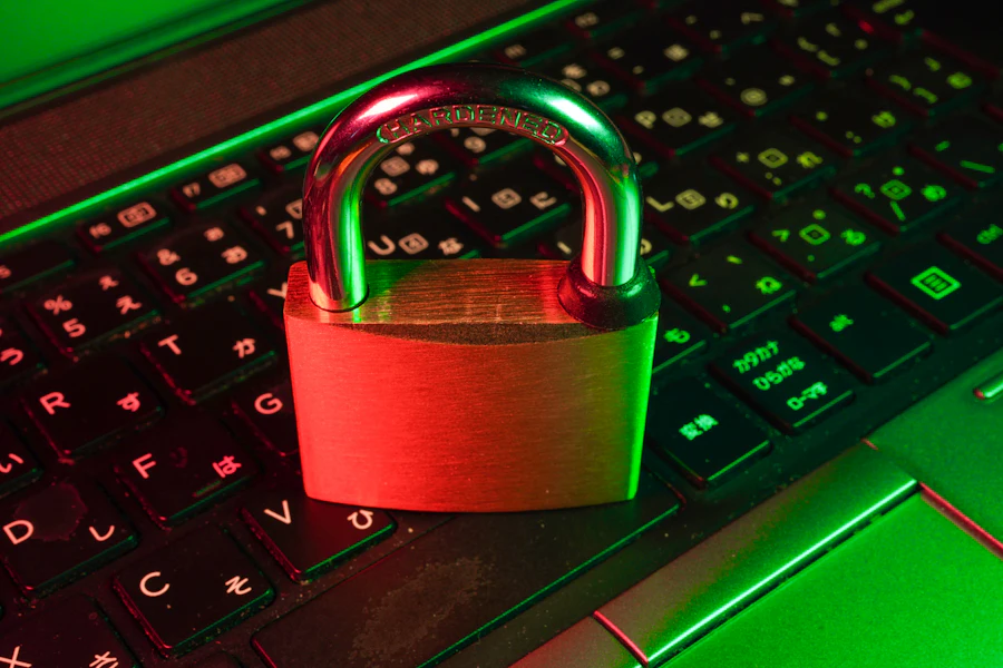 Red padlock resting on a black computer keyboard